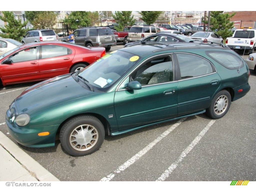 1999 Taurus SE Wagon - Tropic Green Metallic / Medium Graphite photo #1