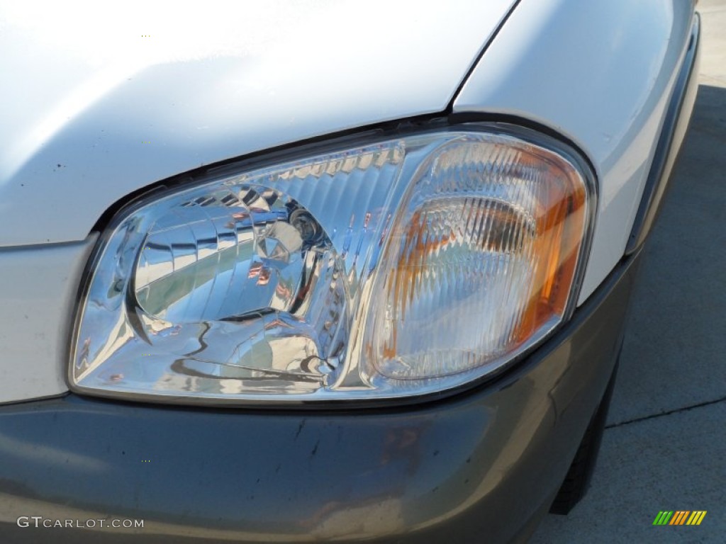 2004 Tribute LX V6 - Classic White / Medium Pebble Beige photo #9