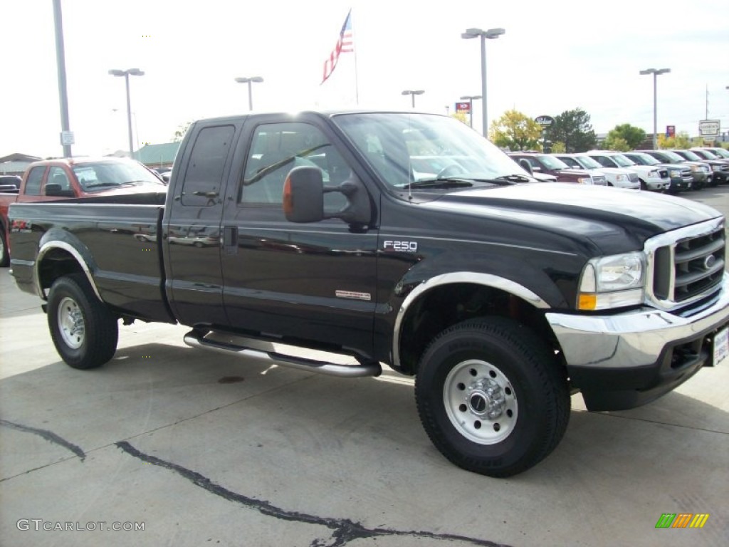 2004 F250 Super Duty XLT SuperCab 4x4 - Black / Medium Flint photo #16