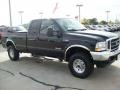 2004 Black Ford F250 Super Duty XLT SuperCab 4x4  photo #16