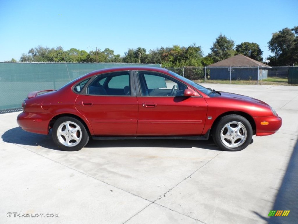 1999 Taurus SE - Toreador Red Metallic / Medium Graphite photo #2