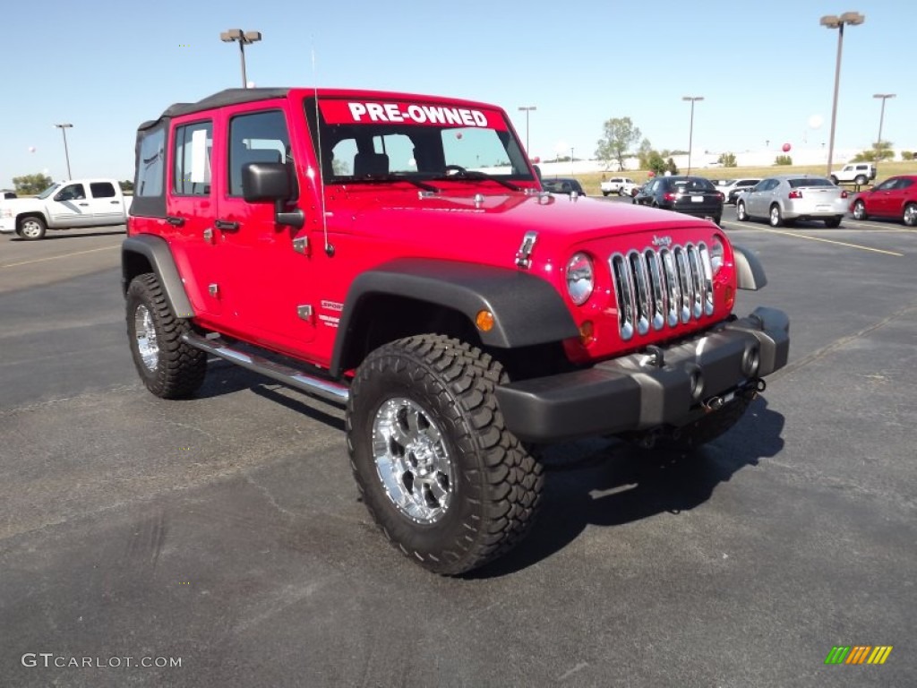 Flame Red 2010 Jeep Wrangler Unlimited Sport 4x4 Exterior Photo #55602400