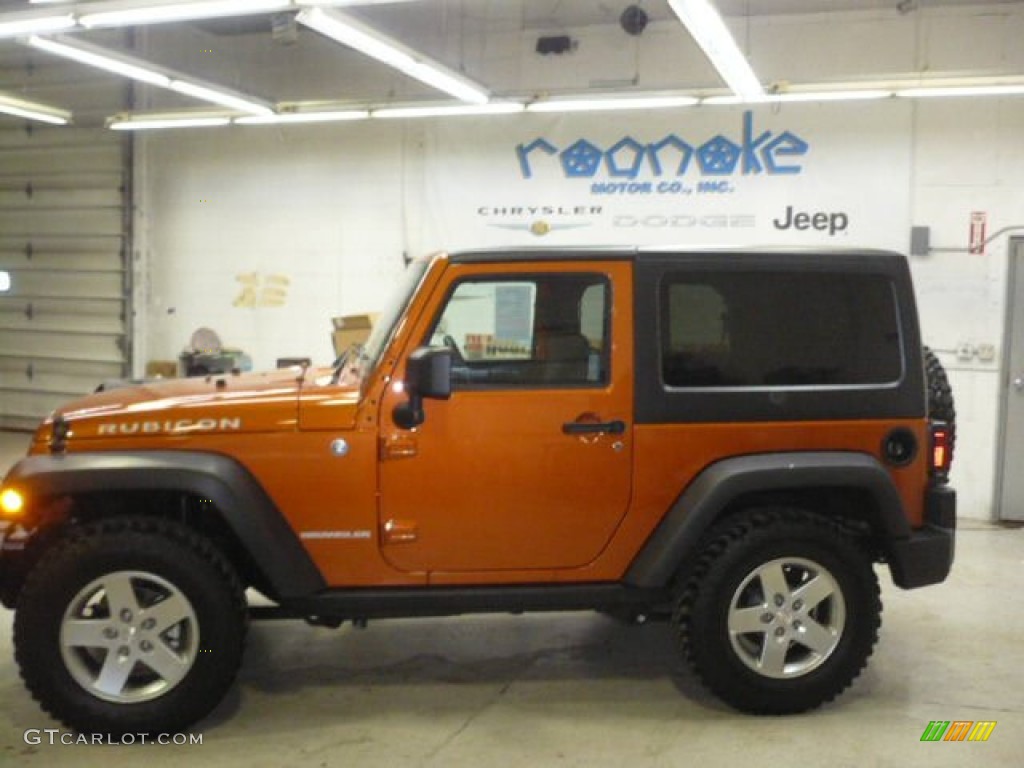 2011 Wrangler Rubicon 4x4 - Mango Tango Pearl / Black photo #2