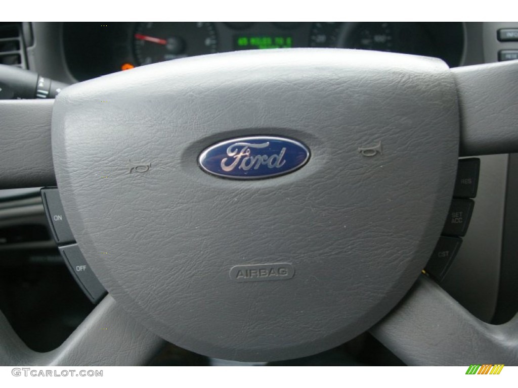 2004 Taurus SE Sedan - True Blue Metallic / Dark Charcoal photo #6