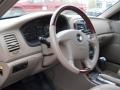 2004 Kia Optima Beige Interior Steering Wheel Photo