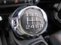2012 Jeep Wrangler Unlimited Black with Polar White Accents/Orange Stitching Interior Transmission Photo