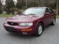 1995 Ruby Red Pearl Nissan Maxima GXE  photo #1
