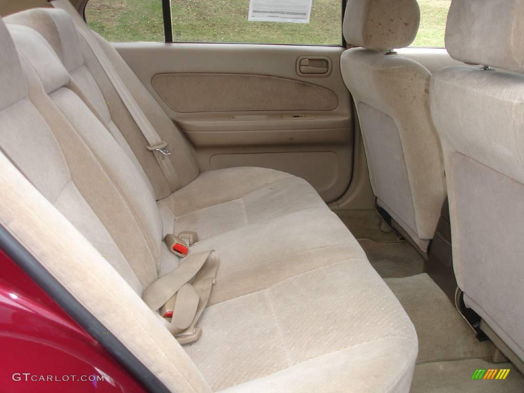 1995 Maxima GXE - Ruby Red Pearl / Beige photo #14