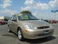 2000 Fort Knox Gold Metallic Ford Focus SE Sedan  photo #1