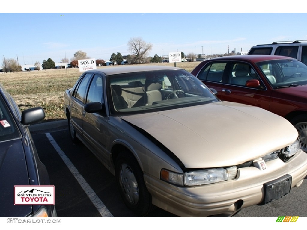 1994 Cutlass Supreme Sedan - Light Beige Metallic / Beige photo #1