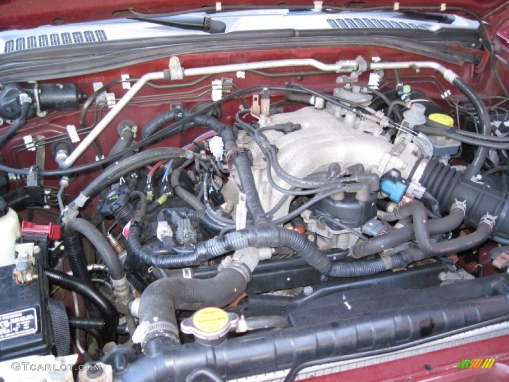 2004 Xterra XE 4x4 - Thermal Red Metallic / Charcoal photo #27