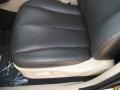 After-market Black seat covers on Ivory interior