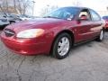 2003 Matador Red Metallic Ford Taurus SEL  photo #1