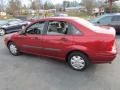 2000 Sangria Red Metallic Ford Focus LX Sedan  photo #8