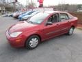 2000 Sangria Red Metallic Ford Focus LX Sedan  photo #10