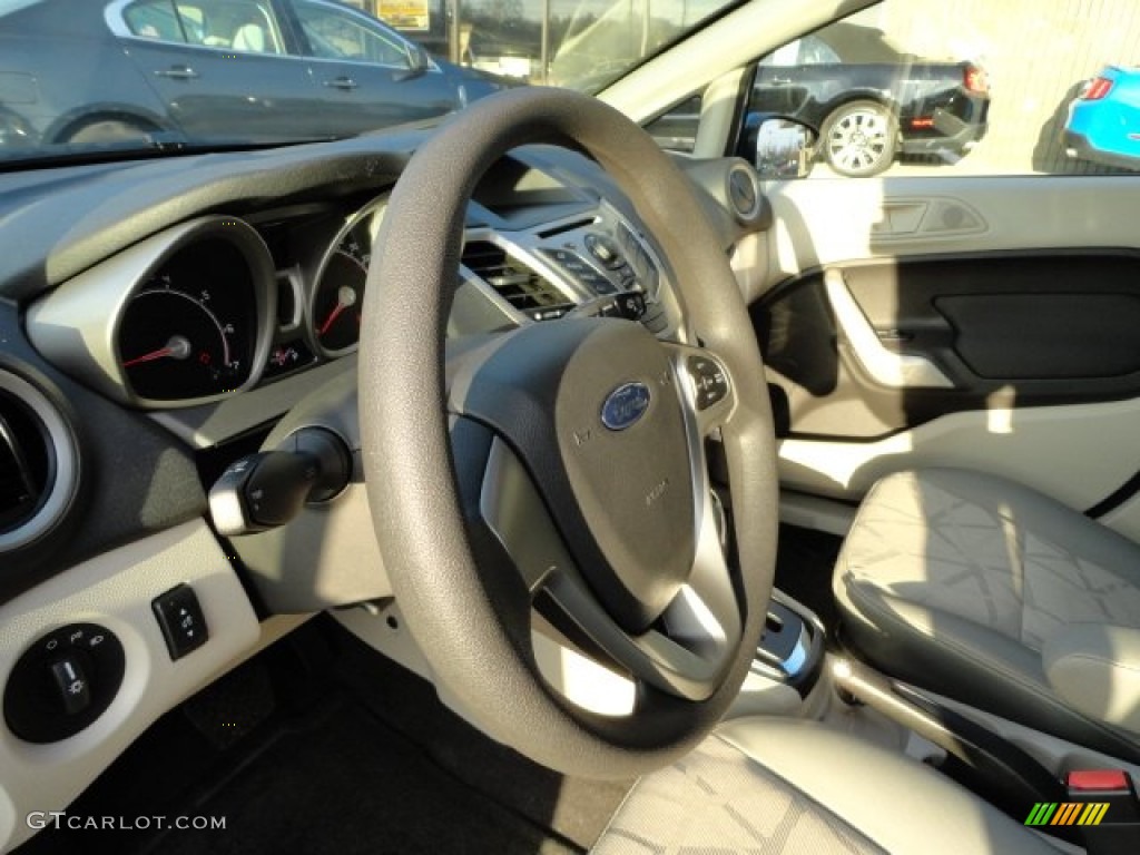 2012 Ford Fiesta SE Hatchback Light Stone/Charcoal Black Steering Wheel Photo #57786576