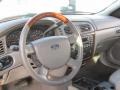 Medium Parchment Steering Wheel Photo for 2004 Ford Taurus #57824684