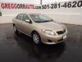 2010 Desert Sand Metallic Toyota Corolla LE  photo #1