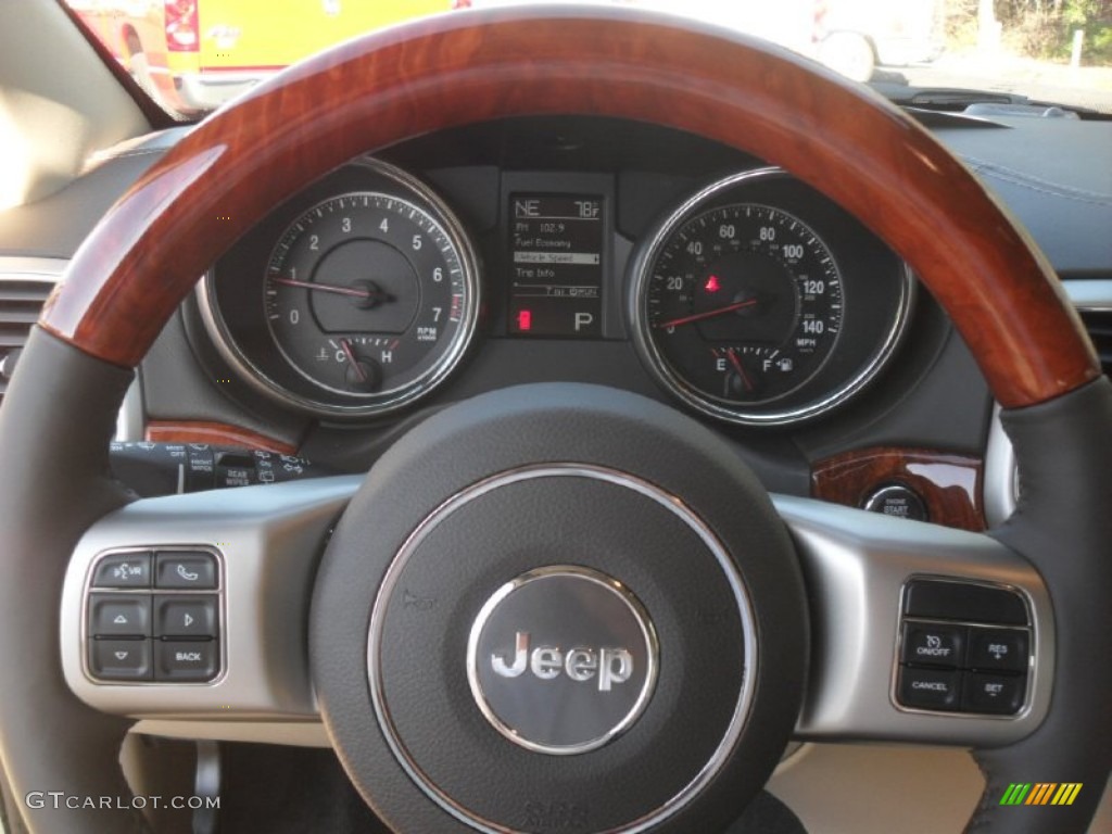 2012 Jeep Grand Cherokee Overland 4x4 Dark Frost Beige/Light Frost Beige Steering Wheel Photo #58056247