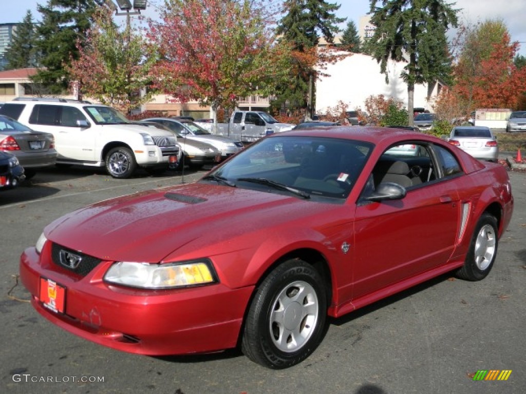 Laser Red Metallic 1999 Ford Mustang V6 Coupe Exterior Photo #58062358