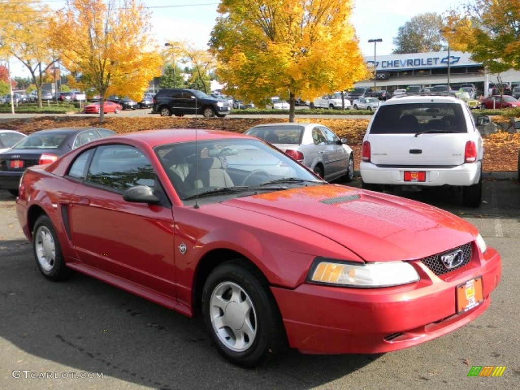 1999 Mustang V6 Coupe - Laser Red Metallic / Dark Charcoal photo #2