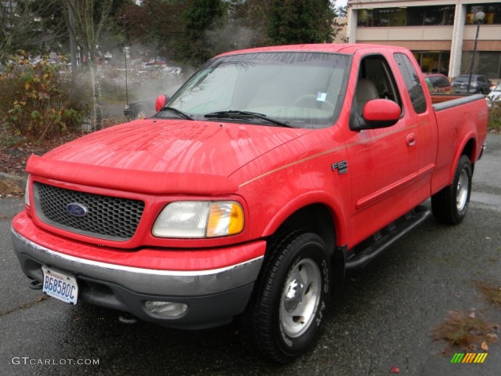 2000 F150 XLT Extended Cab 4x4 - Bright Red / Medium Graphite photo #1