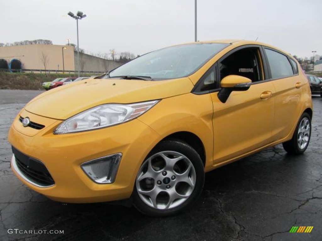 2011 Fiesta SES Hatchback - Yellow Blaze Metallic Tri-Coat / Charcoal Black/Blue Cloth photo #1