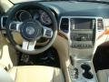 2012 Jeep Grand Cherokee Black/Light Frost Beige Interior Dashboard Photo