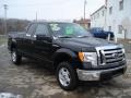 2009 Black Ford F150 XLT SuperCab 4x4  photo #2