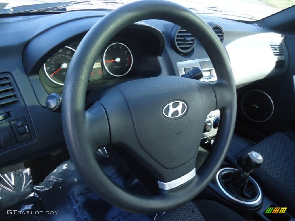 2004 Hyundai Tiburon Standard Tiburon Model Black Steering Wheel Photo #59377670
