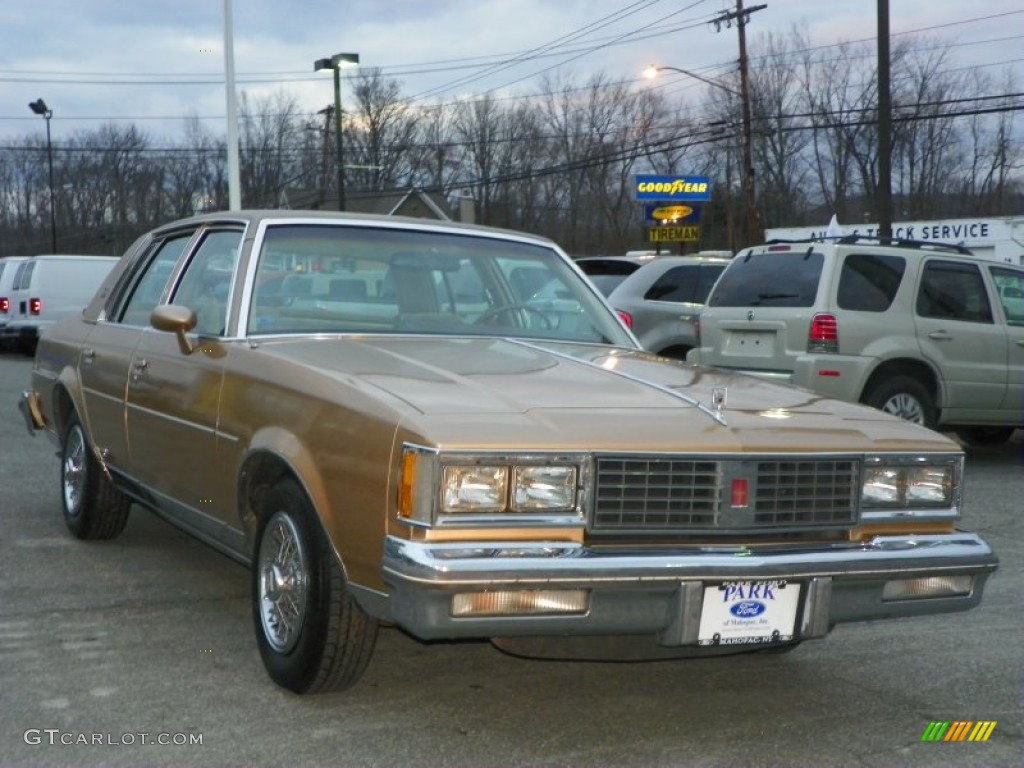 1987 Cutlass Supreme Brougham - Sungold Metallic / Beige photo #2