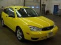 2005 Egg Yolk Yellow Ford Focus ZX3 SES Coupe  photo #23