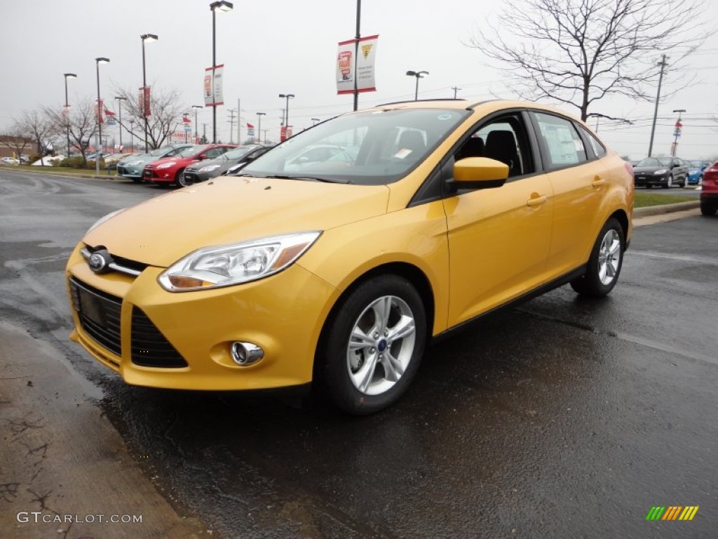 2012 Focus SE Sport Sedan - Yellow Blaze Tricoat Metallic / Two-Tone Sport photo #1