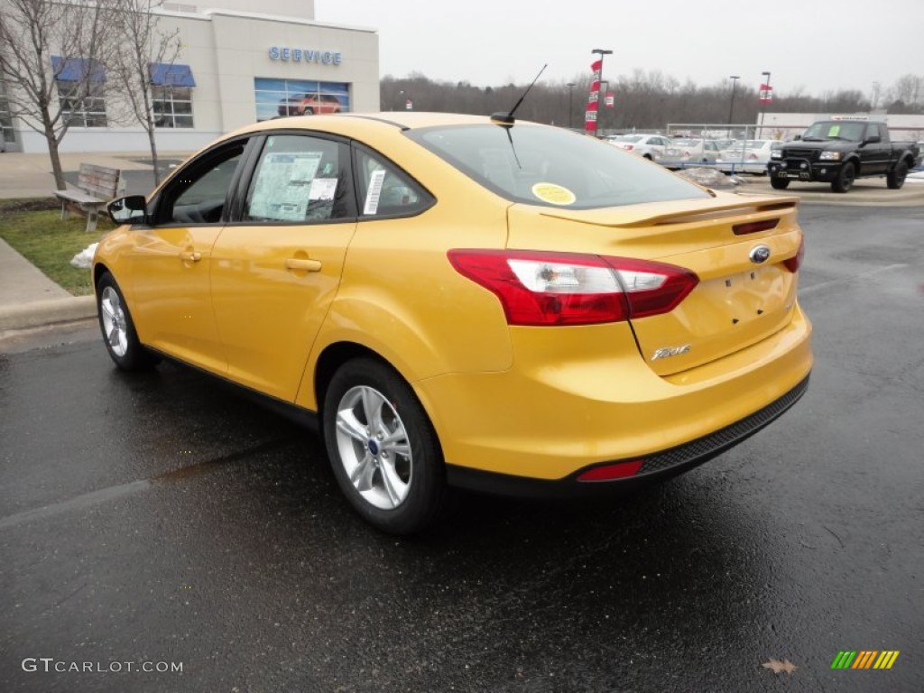 Yellow Blaze Tricoat Metallic 2012 Ford Focus SE Sport Sedan Exterior Photo #60094128