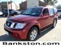 2010 Red Brick Nissan Pathfinder SE  photo #1