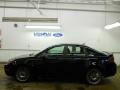 2011 Ebony Black Ford Focus SES Sedan  photo #15