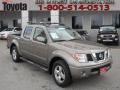 2006 Polished Pewter Nissan Frontier LE Crew Cab 4x4  photo #1