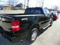 2005 Black Ford F150 STX SuperCab 4x4  photo #7