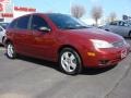 2005 Sangria Red Metallic Ford Focus ZX5 SES Hatchback  photo #2