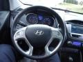 2010 Hyundai Tucson Black/Saddle Interior Steering Wheel Photo
