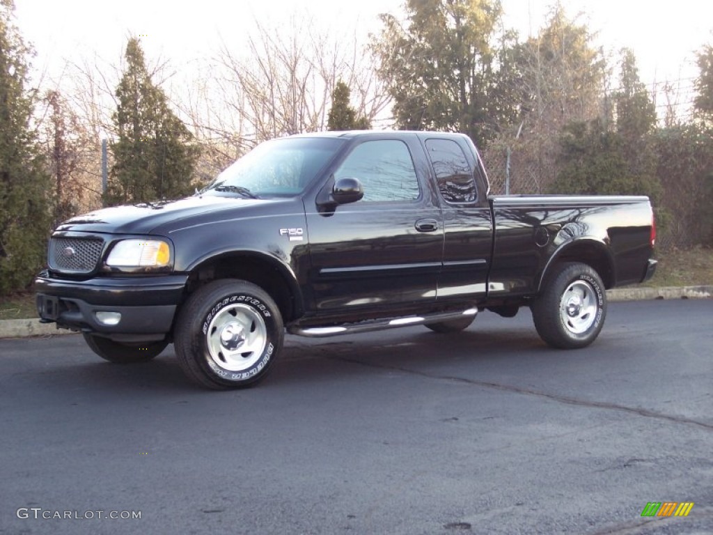 2000 F150 XLT Extended Cab 4x4 - Black / Medium Graphite photo #1