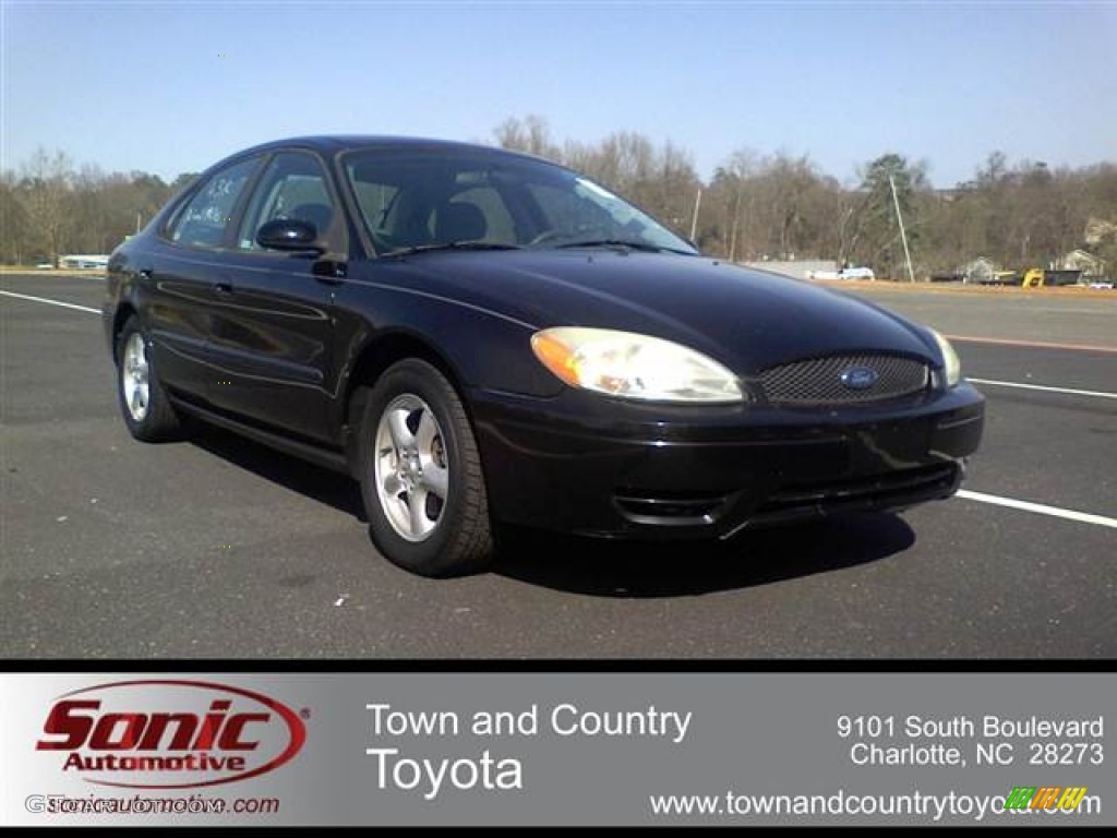 2004 Taurus SE Sedan - Black / Medium Graphite photo #1