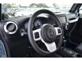 Black with Polar White Accents/Orange Stitching 2012 Jeep Wrangler Unlimited Sahara Arctic Edition 4x4 Steering Wheel