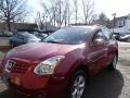 2010 Venom Red Nissan Rogue SL AWD  photo #1