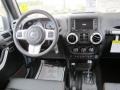 2012 Jeep Wrangler Unlimited Black with Polar White Accents/Orange Stitching Interior Dashboard Photo
