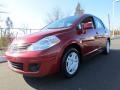 2011 Red Brick Nissan Versa 1.8 S Sedan  photo #1