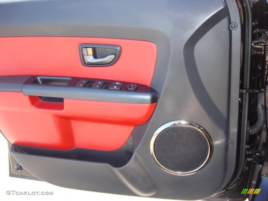 2011 Kia Soul Sport Red/Black Sport Cloth Door Panel Photo #63052616