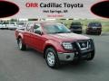 Red Brick 2010 Nissan Frontier SE Crew Cab 4x4