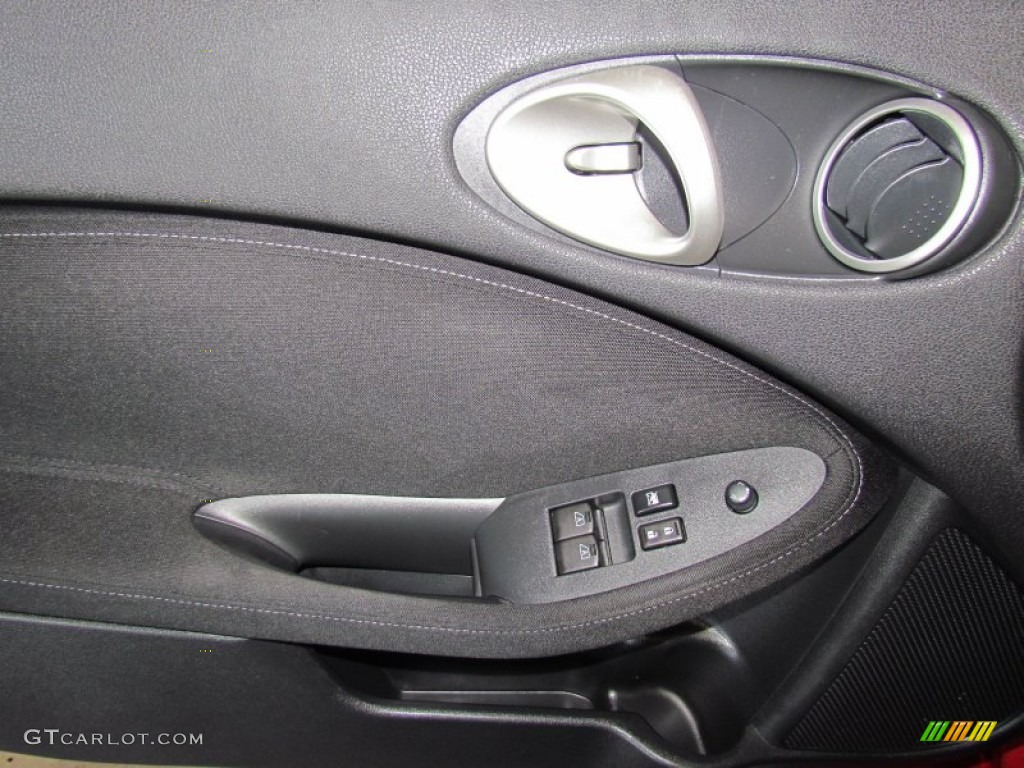 2010 Nissan 370Z Sport Coupe Black Cloth Door Panel Photo #63356588