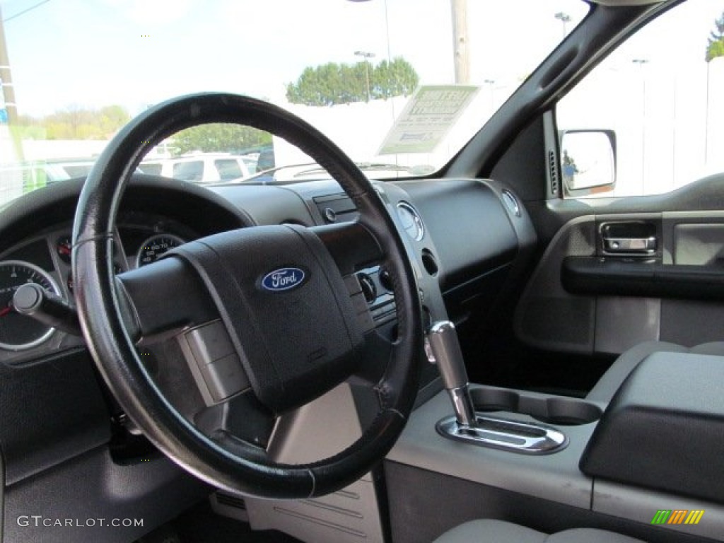 2006 Ford F150 FX4 SuperCab 4x4 Black/Medium Flint Steering Wheel Photo #63393565